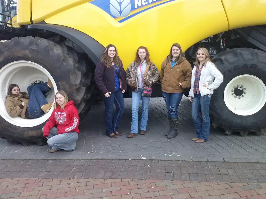 From left to right: Maggie Thurman, Shana Gauldin, Morgan Crews, Tori Hedman, Savannah Childres, and Kaitlyn Jefferies got to check out new farm equipment at the FFA field trip on Thursday, February 6, 2014.