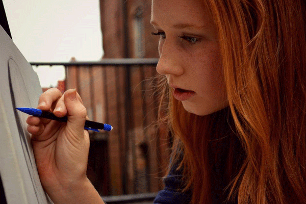 Kelsey works on one of her numerous sketches.