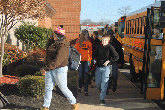 Students bundle up as they enter school for the first two hour delay of the year.
