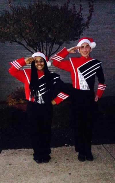 Drum Majors Candace and Blake Mitchell salute before the Christmas Parade. 