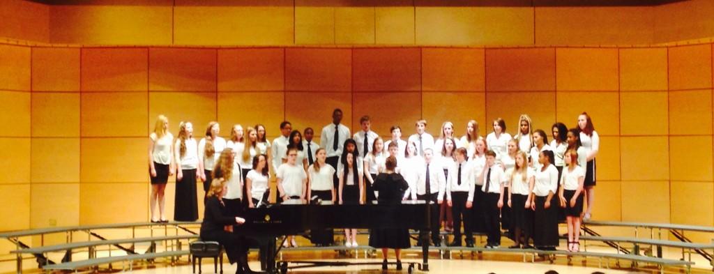 Ms. Robertson directing the middle school chorus at districts. 