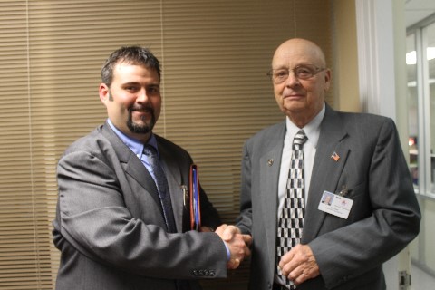 Vice Chairman Neal Oakes congratulates Tunstalls new principal, Mr. Boles.