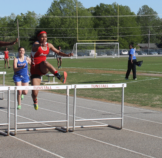 Freshman Tommari Lee sprints the 100 meter hurdles.