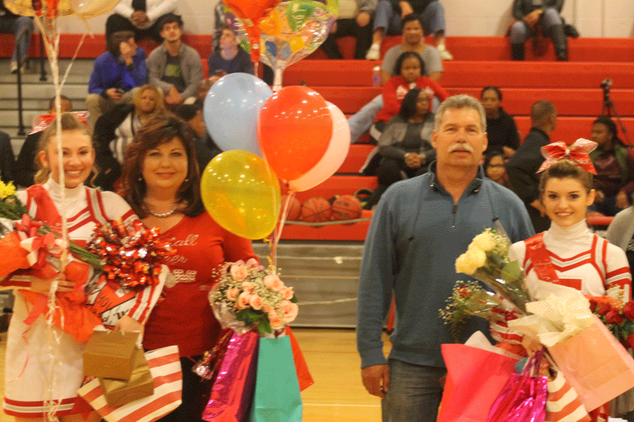 Seniors Holly Patterson and Rebecca Scearce are recognized before the game on senior night. 