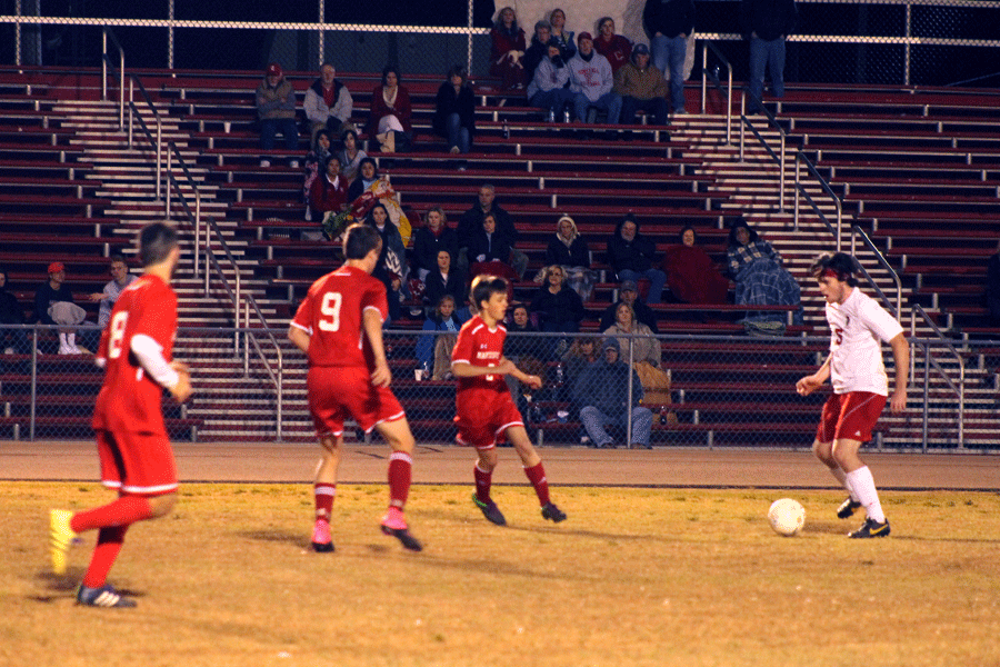 Senior Greyson Cooke takes on three Martinsville defenders.