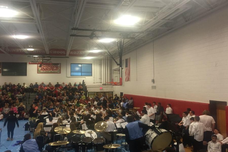 Mrs. Kellie Harlow Knapp conducts the band as they begin on their first piece