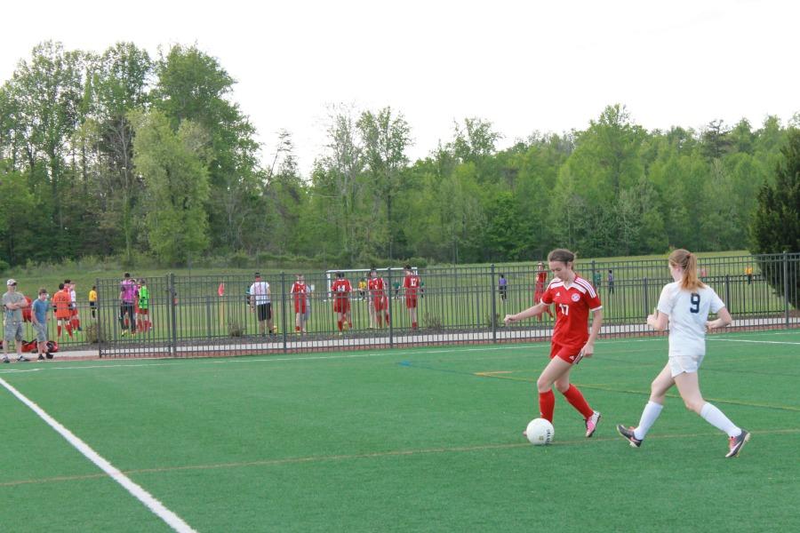 Senior Rhayne Tucker dribbles the ball past a Magna Vista Player