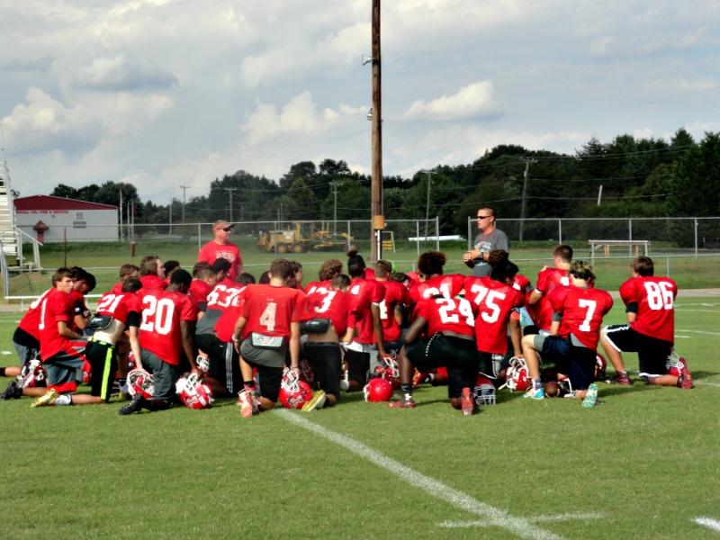 Coach+David+Potts+huddles+his+team+around+after+practice+as+he+discuss+his+plans+for+tomorrows+game+vs.+Rustburg+