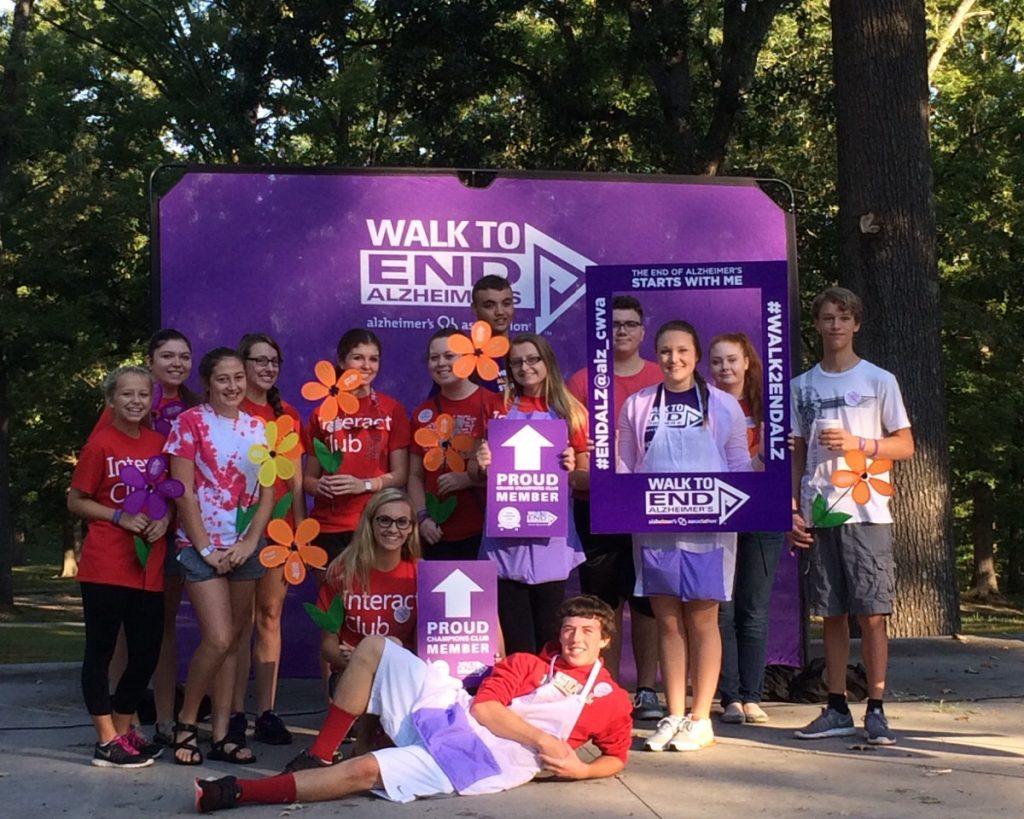 Fourteen Interact students spent their Saturday morning setting up sponsor tables, holding signs, handing out flowers, or just showing their support by walking. 