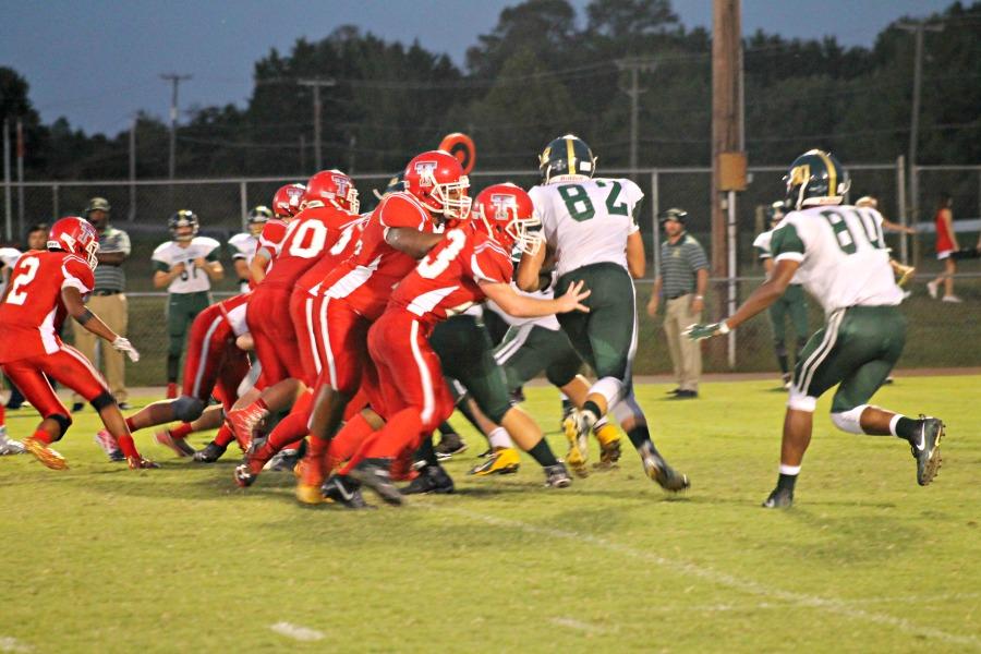Tunstalls offensive line blocks the Cougars defense as Lovelace carries the ball