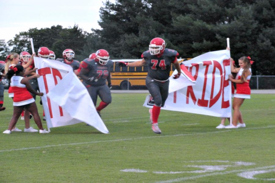 Defensive end Sage McBride leads the Trojans into breaking the banner