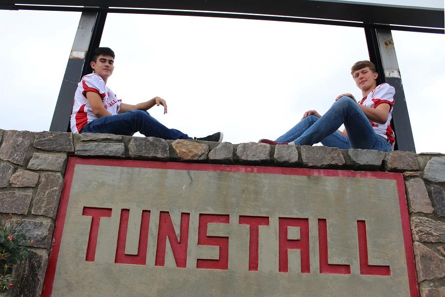 Aron Zahrodka (right) and Leandro Souza (left) sporting their football jerseys before their JV football game. 