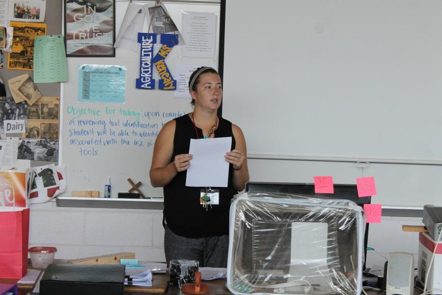 Ms. Kenealy advocating her students into learning safety drills for shop class. 