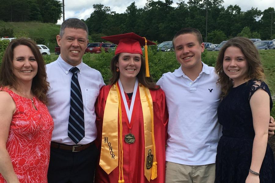 The family gathers for a picture at Hannahs high school graduation.