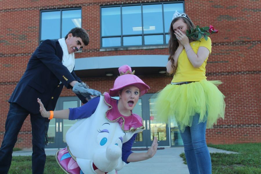 Landon Siggers, Sarah Goard, and Kamryn Tucker reenact Beauty and the Beast.  