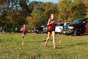 Emily Wallace fights the pain to maintain first place.