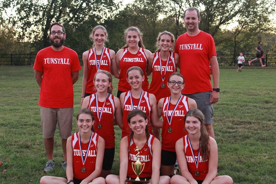 The Lady Trojans took home the gold for Tunstall to receive a trophy.
