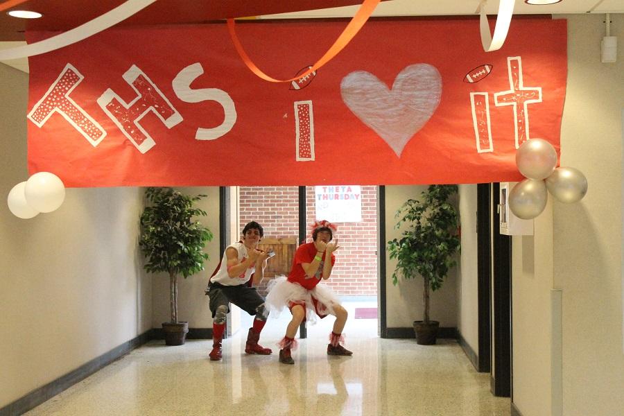 Josh Jarell and Sean Gunter show off their school spirit under the banner. 