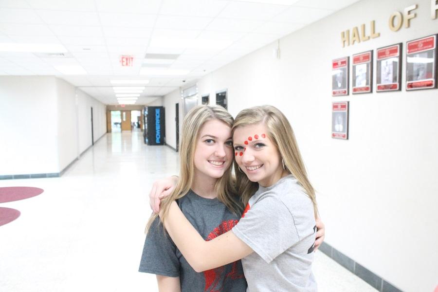 Kenzie Goad and Allison Sparks hug. 