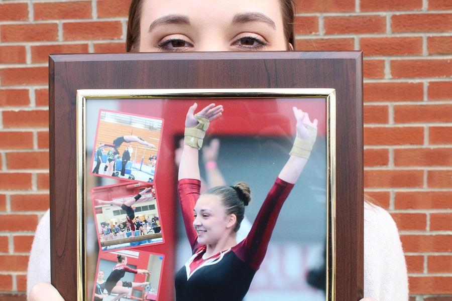 The picture that Rebecca is holding is of the very last time she competed.