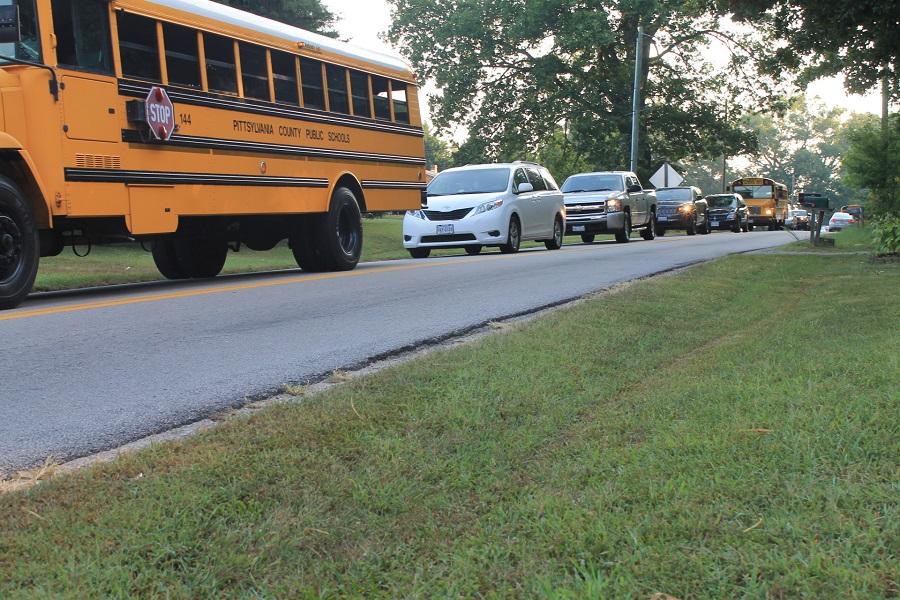 The traffic is congested during peak hours, mainly on the eastbound approach towards the intersection.