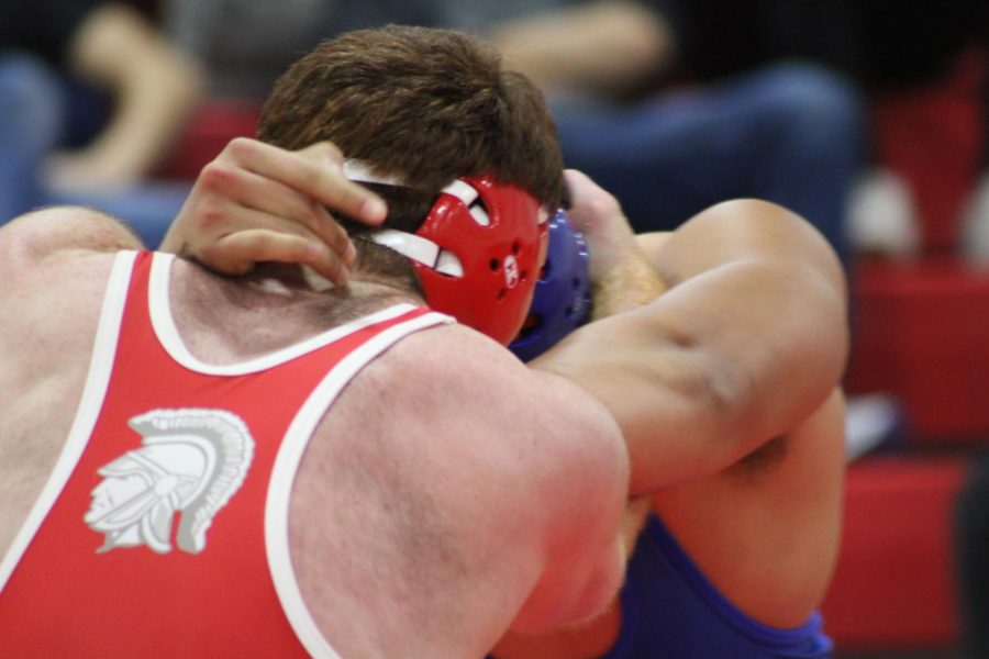 Junior Clay Hardy wrestling against his opponent on Jan. 24. 