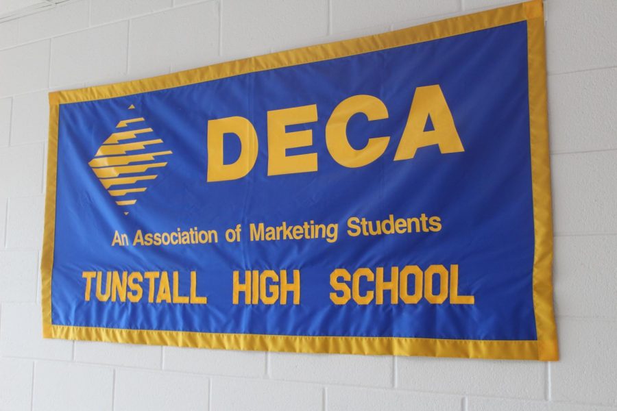 DECA students dominate in districts