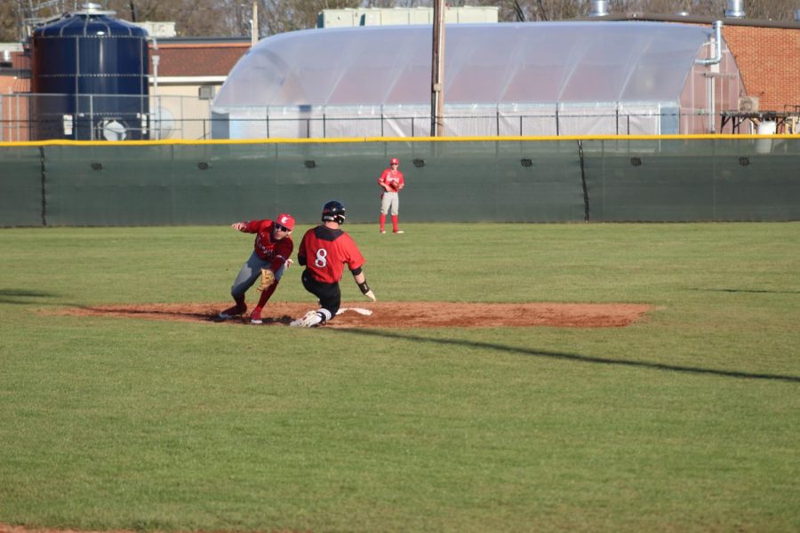 Senior Hunter Scarce tags out Cavalier player on second base.  