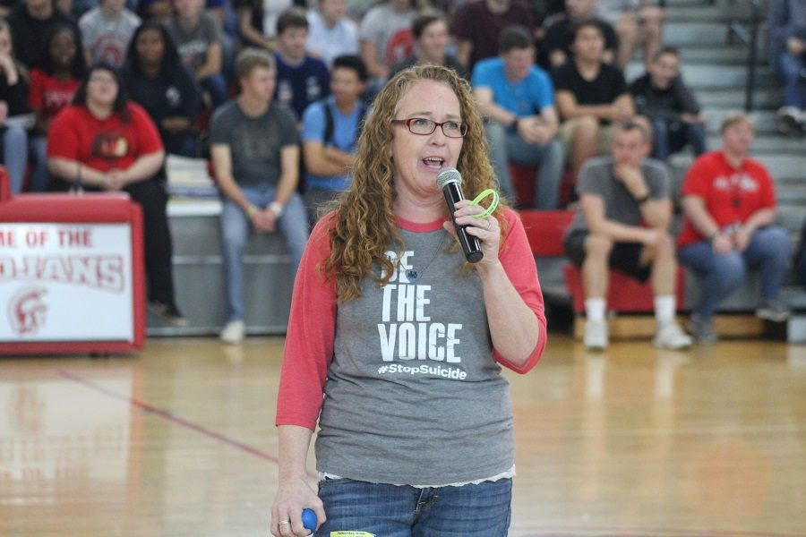 LeAnne+Hardy+speaks+to+Trojans+during+halftime+at+Fridays+faculty%2Fstudent+basketball+game.+