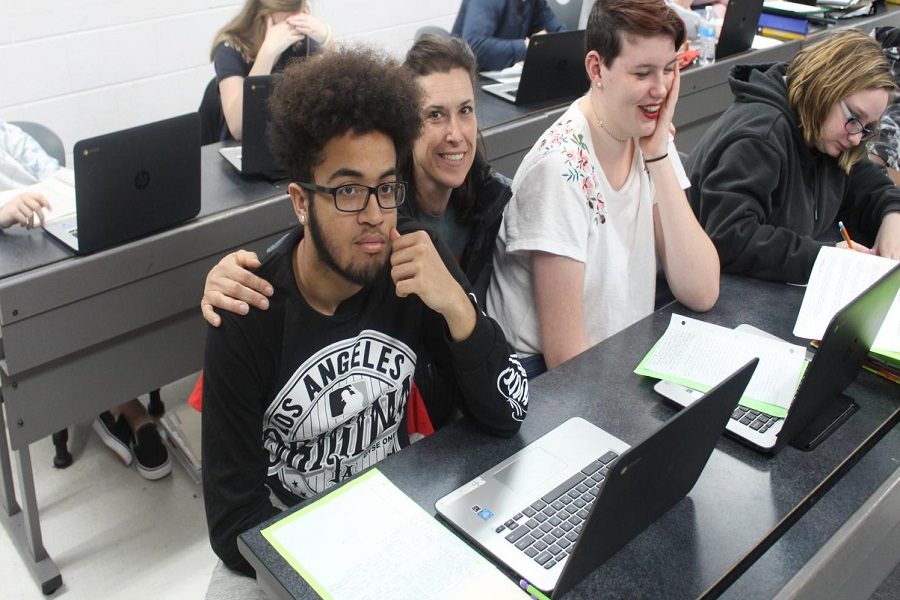 Dallas smiles for a picture while assisting students in her second period class. 