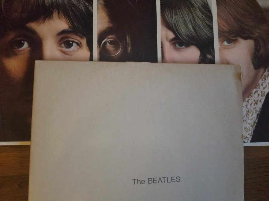 Photographs of the Beatles are included with the vinyl purchase of the White Album. 