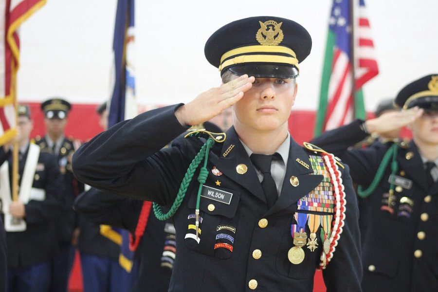 Dakota Wilson salutes the flag. 