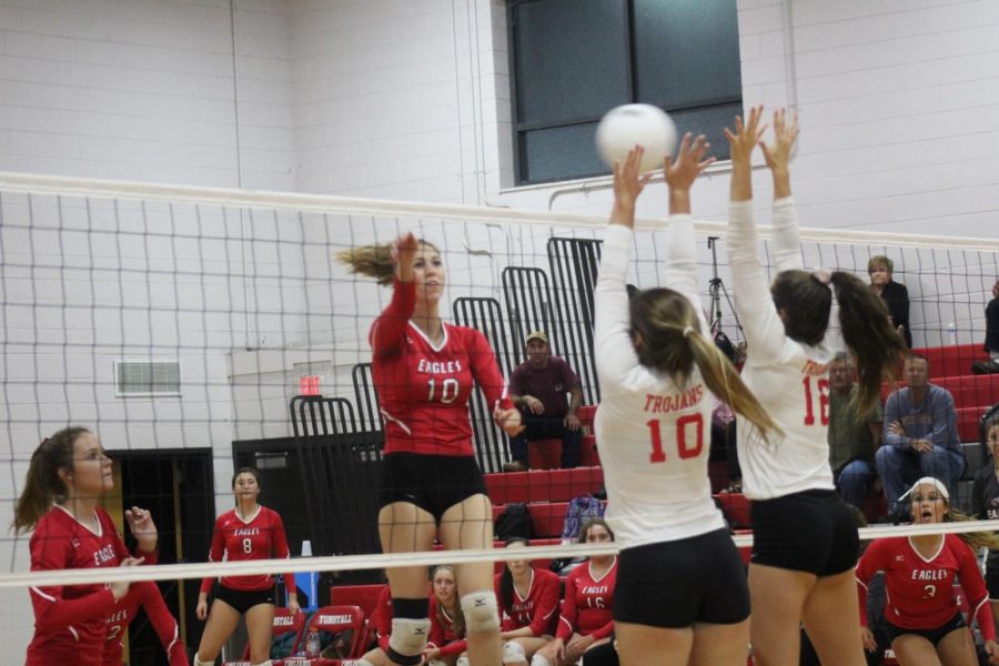 Kinsley Stevens and Brooklyn Owens block the ball against a strong Eagles offense. 
