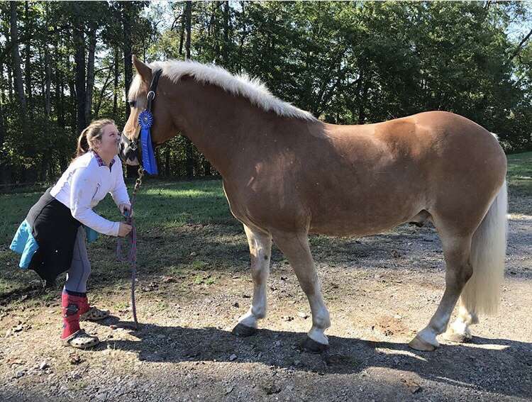 Virginia Jones posing with her horse