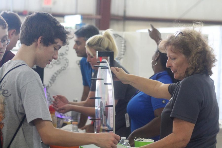 Sophomore Cody Payne plays The Wheel of Fortune for  L&G Support Services LLC 