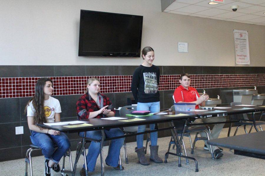 President Megan Pollock gives the opening ceremony with Vice President Ginny Neal, Treasurer Abbie Hyler, and Reporter Derek Dallas 