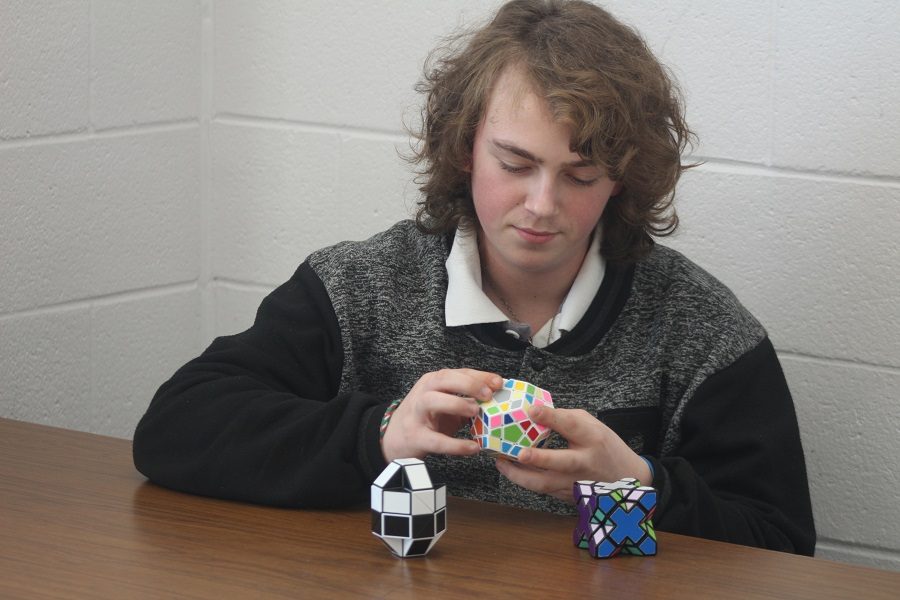 Jeffrey Coates solves a complicated Rubiks Cube. 