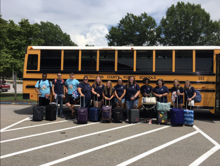 2018-2019 Beta members seen taking a picture in front of the bus as they depart for RDU airport. 