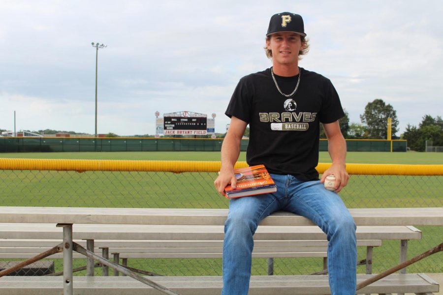 Senior Grant Elliott shows off his UNC Pembroke attire along with his Spanish work. 