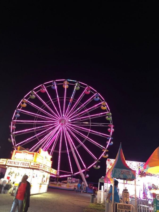 The lit up Ferris wheel at the local Pittsylvania County Fairgrounds.