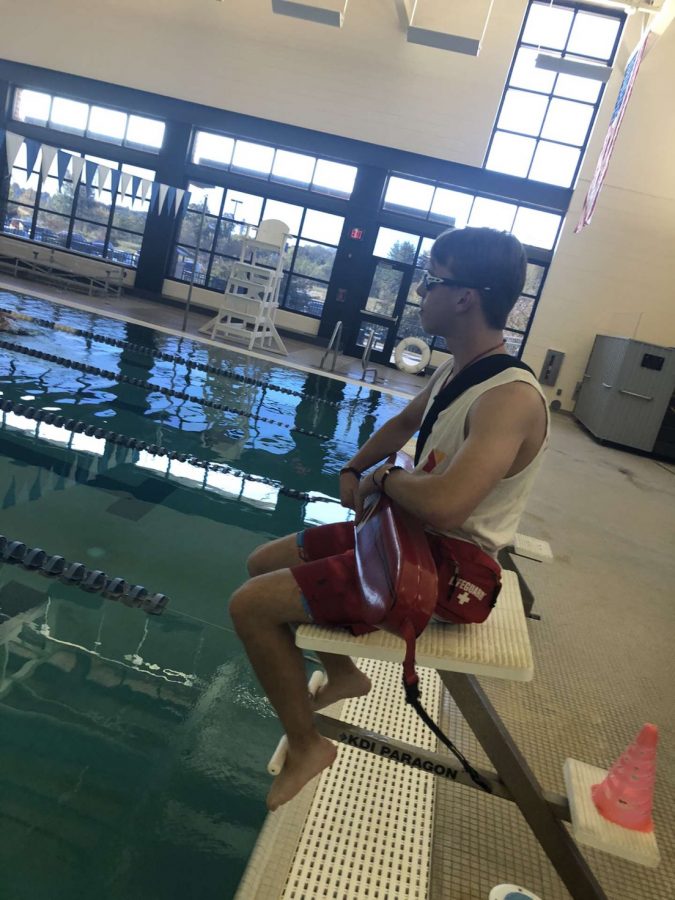 Sophomore Chaz Nickens watches over the people swimming at the Danville YMCA