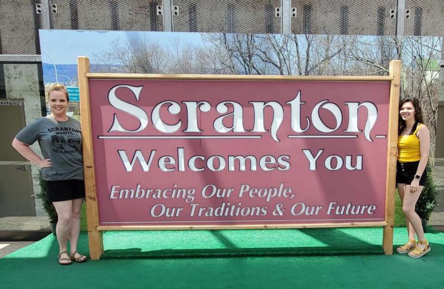 Junior Savannah Scearce poses with a sign in Scranton, Pennsylvania. 