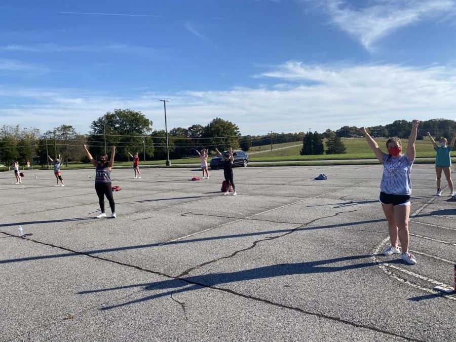 Tunstall cheerleaders practicing while remaining socially distant. 