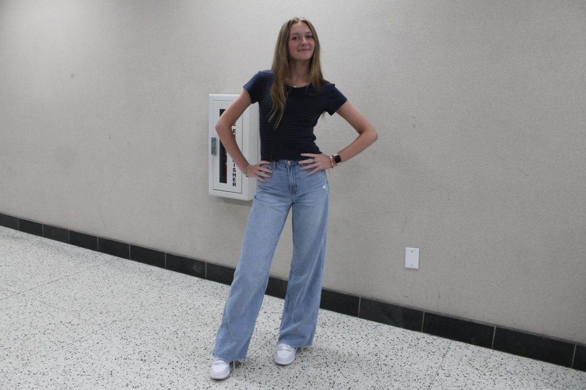 Brooklyn Philpott wearing wide leg jeans.