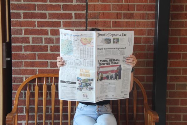 Sophomore Makenzie Miller reading the Danville Register and Bee