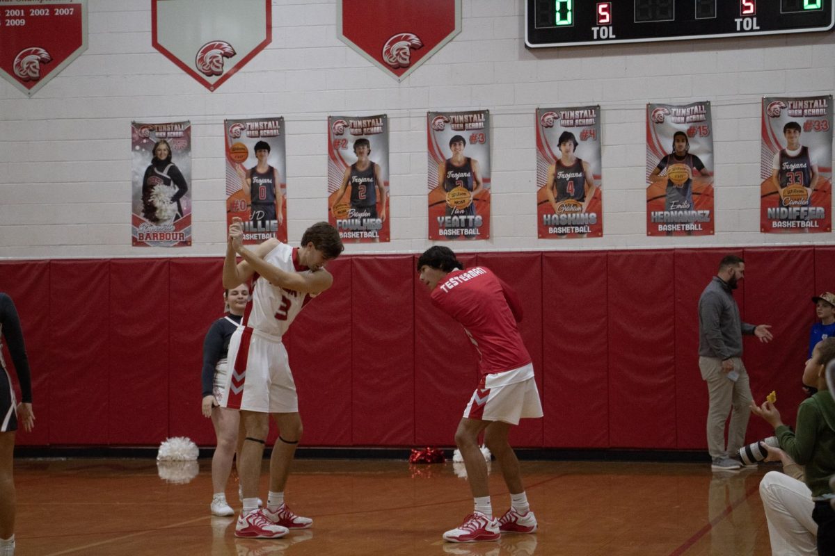 senior Ian Yeatts and junior Jacob Testerman doing their pre game handshake before a match against Brookville