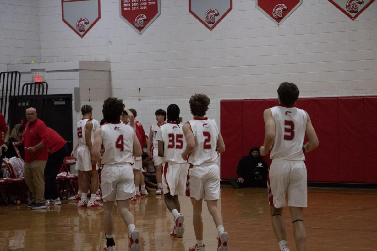 Tunstall players jogging back to the bench after calling a timeout