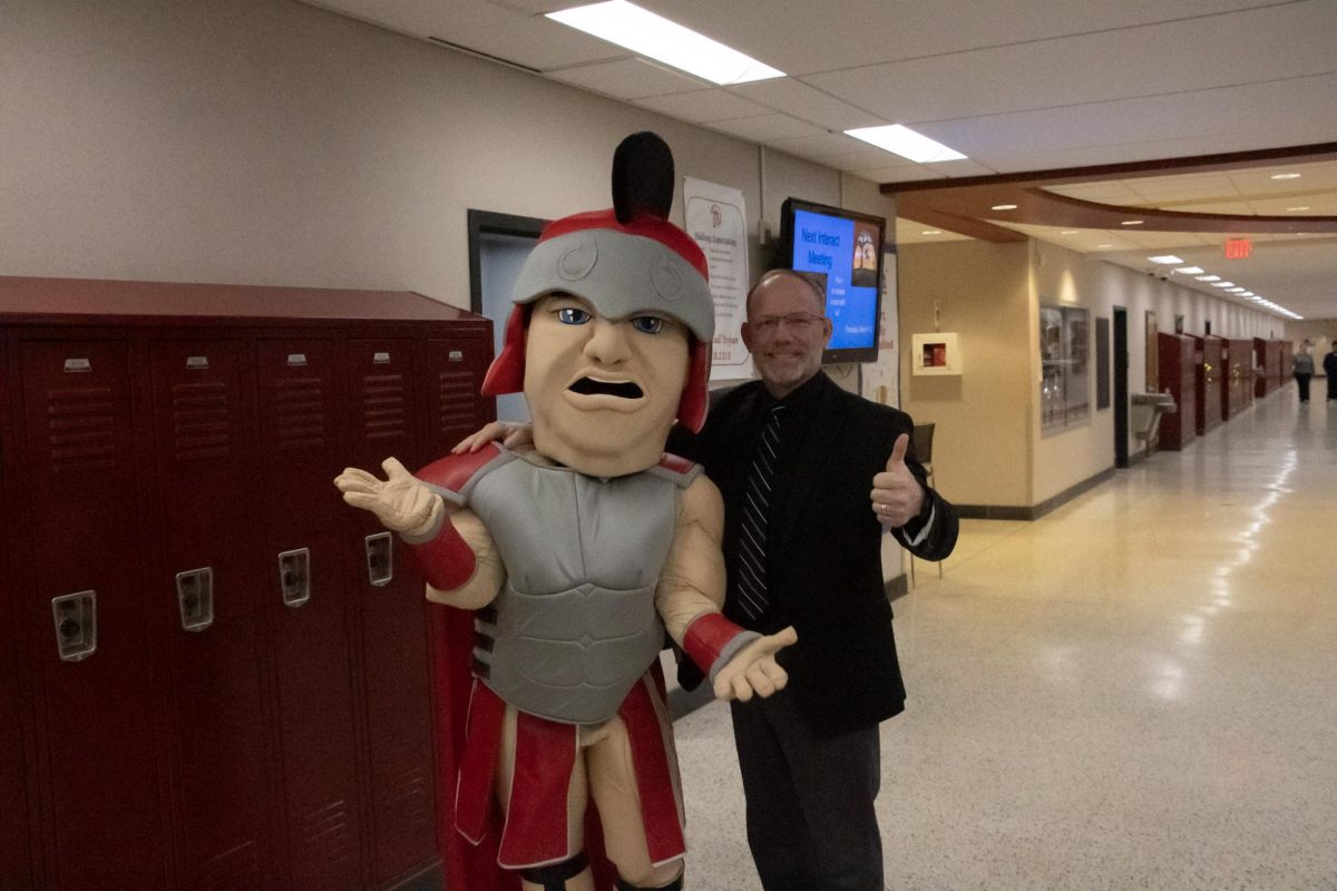 DeVivi next to our Trojan mascot.