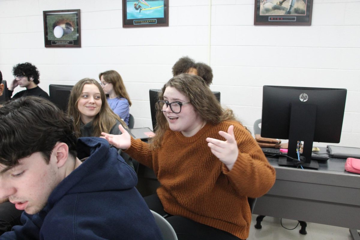 Senior Miranda Smallwood joking around with her friends during class.