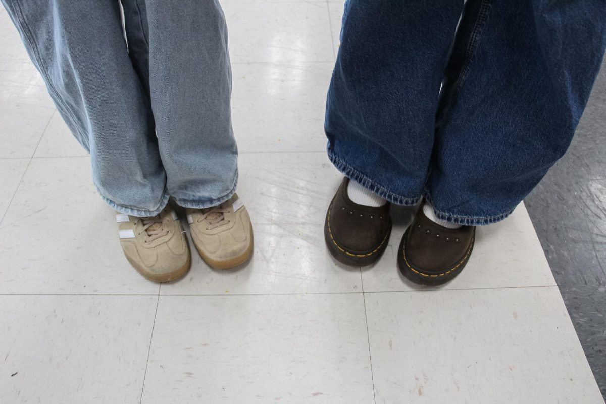 Juniors Kayleigh Mazza and Delaney Mantooth posing with their spring shoes. 